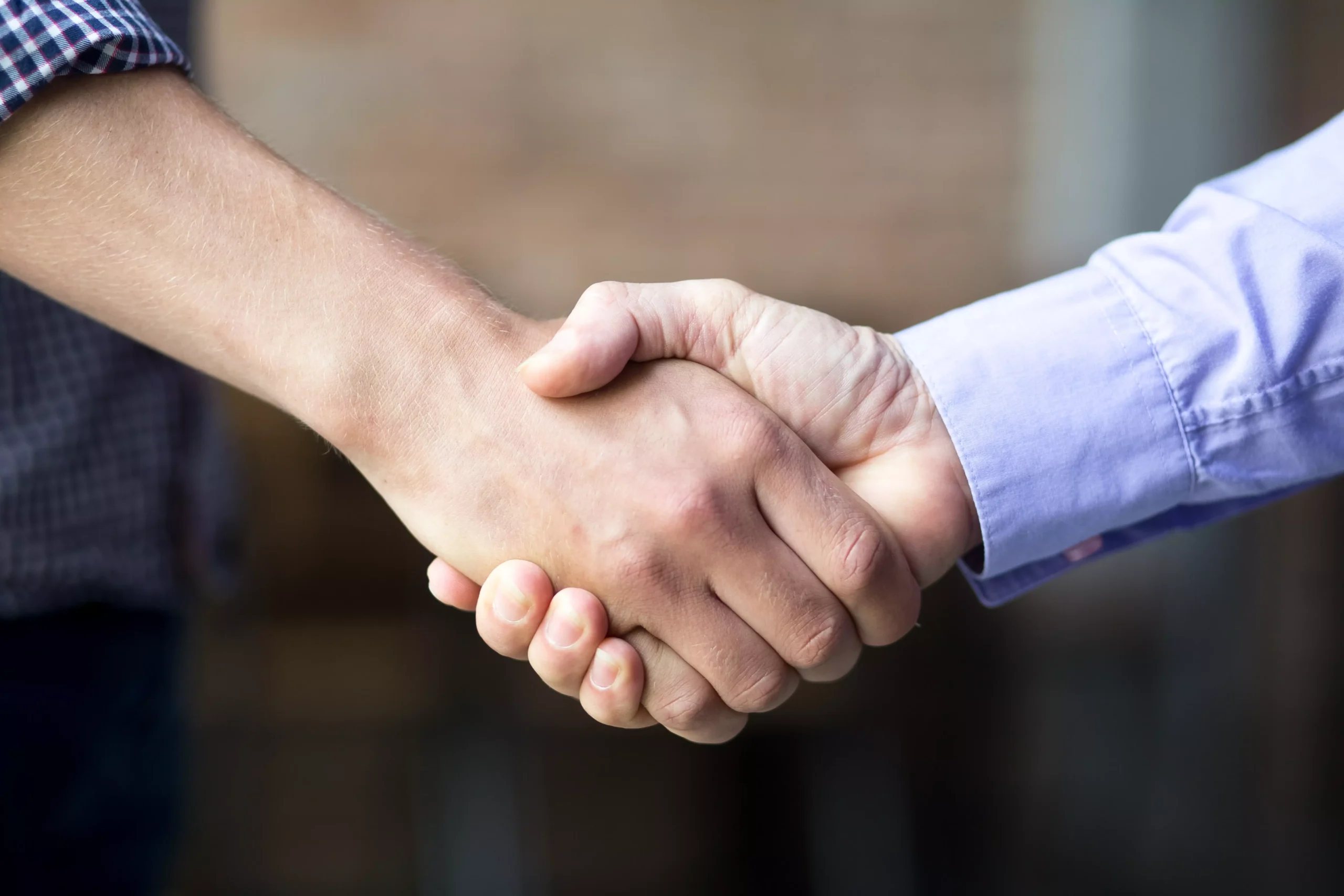 AnyConv.com__closeup-two-business-men-shaking-hands (1)
